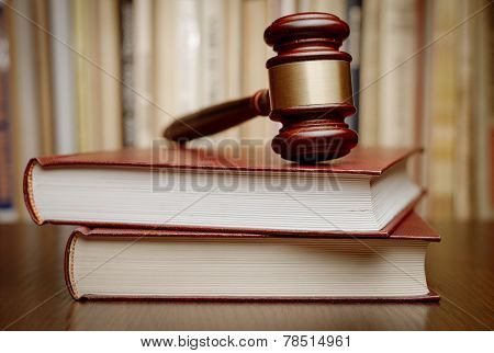 Wooden Gavel Resting On Two Large Books