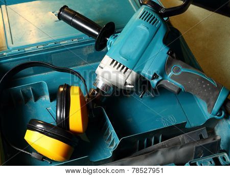 Drill And Earphones In The Box