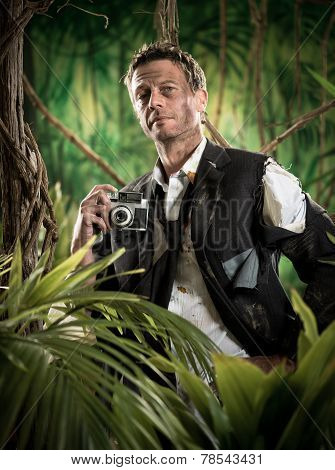 Photoreporter Walking In The Jungle With Vintage Camera