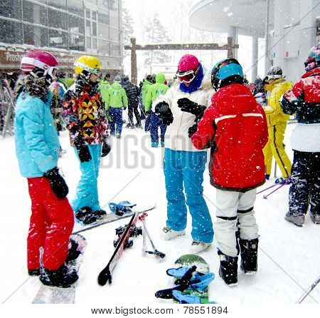 Niseko, Japan -February 2013: Ski, Snowboard Playing With Colorful Jackets