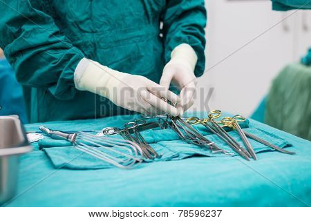 Scrub Nurse Prepare Medical Instruments For Surgery