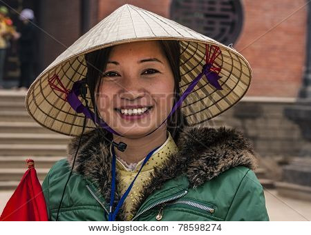 Young Vietnamese Woman With Traditional Hat.