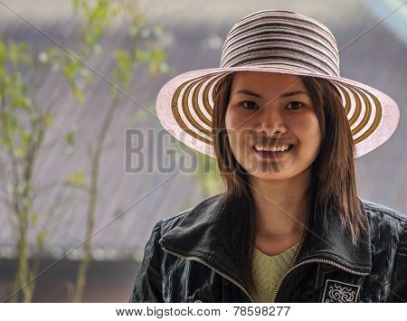Young Vietnamese Woman With Fancy Hat.