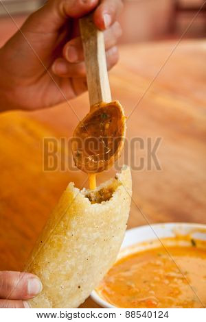 Morocho empanadas served with chilli sauce