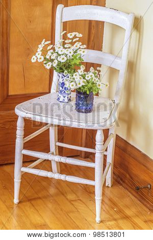 Feverfew in vases with an vintagae look.