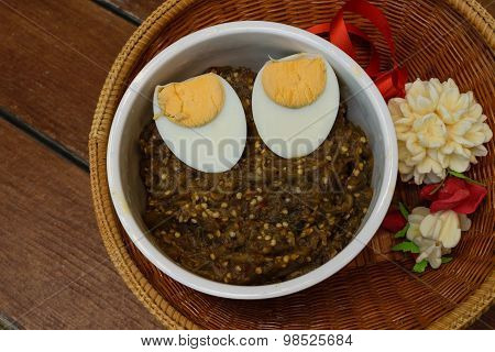 Thai Food Pound Eggplant With Boiled Egg On Wood Table