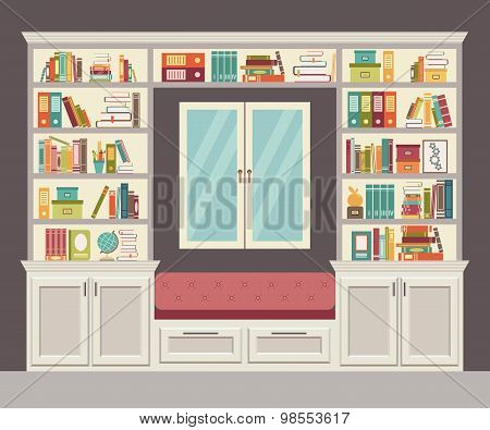 The window seat and wall of books for the home office