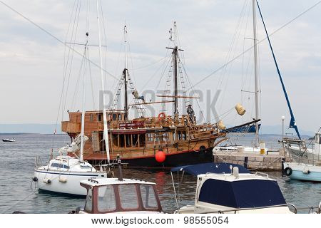 SELCE, CROATIA - JULY 24, 2015: Wooden excursion ship in marina Selce