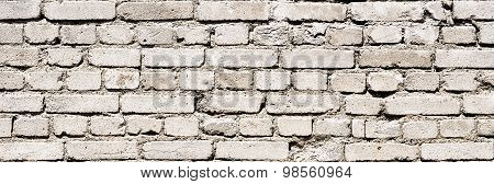 Fragment of old white brick wall