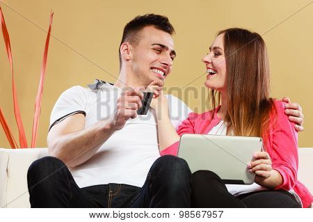 Young Couple With Tablet And Credit Card At Home