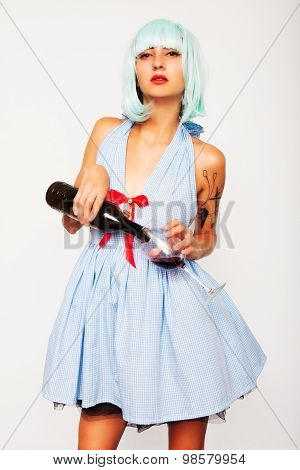 woman in blue wig pouring wine in glass