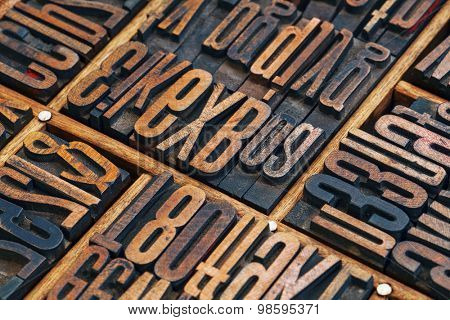 vintage letterpress wood type printing blocks in a typesetter drawer