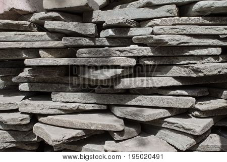 Gray stones stacked one on another. Background of gray stones