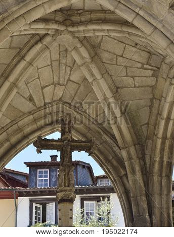 Stone cross in Salado Monument built to commemorate a battle victory in Oliveira Square Guimaraes Portugal.