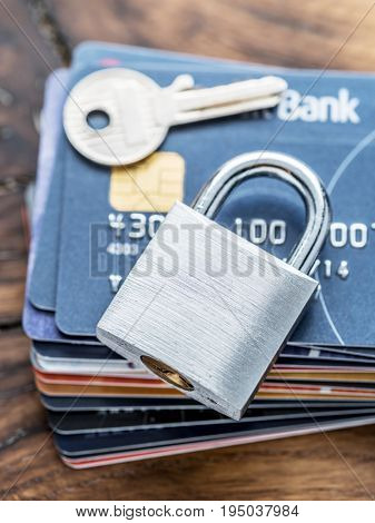 Credit cards and simle mechanical lock. Security concept.