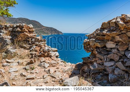 Top Of Spinalonga Island. View Through Ruins To Blue Aegian Sea And Kalydon Island.