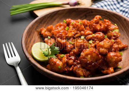 Gobi Manchurian dry - Popular street food of India made of cauliflower florets, selective focus