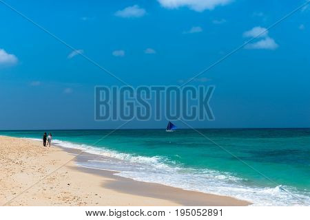 BORACAY WESTERN VISAYAS PHILIPPINES - JANUARY 14 2015: Two women talking in the paradise Puka Beach Boracay.