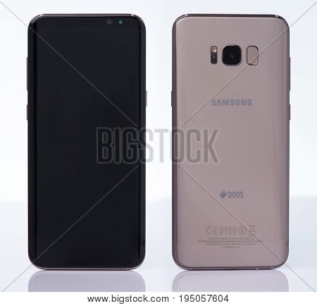New york, USA - July 11, 2017: Back and front view samsung s8+ smartphone isolated on white background.