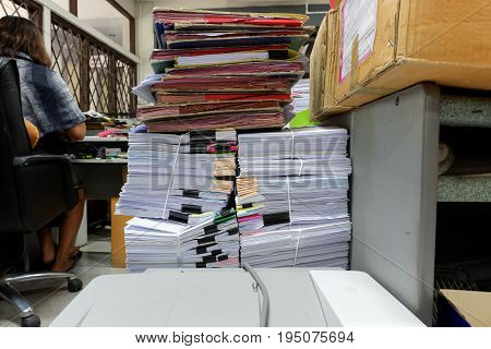 Busy messy and cluttered workplace full of documents