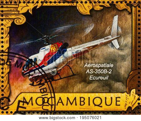 Moscow Russia - July 11 2017: A stamp printed in Mozambique shows French light utility helicopter Aerospatiale AS-350B-2 series 