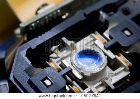 Close up macro. Laser Head reader of cd player system equipment installed on electronics circuit board with selective focus. Electronics equipment concept.