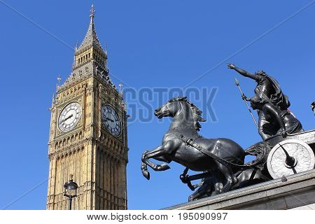 view of Big Ben through bronze sculptural group of Boadicea and Her Daughters at the Westminster Bridge, London, UK