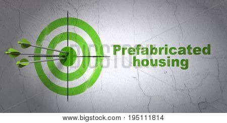 Success construction concept: arrows hitting the center of target, Green Prefabricated Housing on wall background, 3D rendering