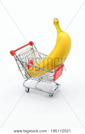 banana in shopping cart on white background