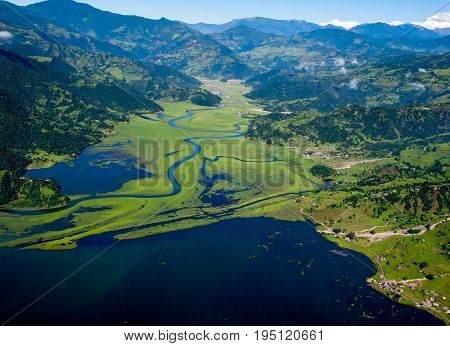 POKHARA, NEPAL. 28 September 2008: Flight on a hang glider (deltaplan). Shooting Pokhara and Phewa lake from the height of bird flight.
