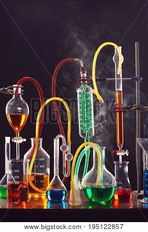 Science equipment including test tubes and flasks
