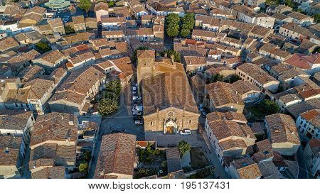Aerial top view of Bram medieval village architecture and roofs from above, Southern France
