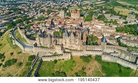 Aerial top view of Carcassonne medieval city and fortress castle from above, Sourthern France