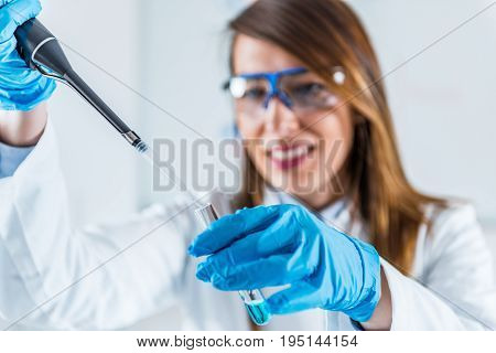 Using Micro Pipette, One Woman Only, Toned Image