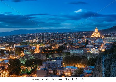 Tbilisi, Georgia. Concert Hall, Metekhi Church, Presidential Administration Palace, Sameba Complex, Holy Trinity Cathedral, Old Historic District Abanotubani In Evening Night Illumination.