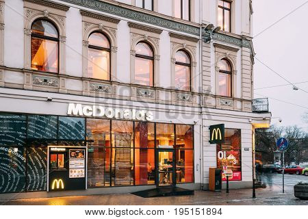 Riga, Latvia - December 14, 2016: Mcdonalds Restaurant Cafe In Old Building In Kalku Street. Mcdonald's Corporation Is The World's Largest Chain Of Hamburger Fast Food Restaurants