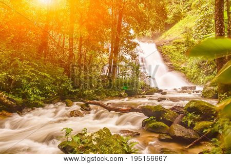 Huai Sai Lueang Waterfall with light lens flare in Doi Intanon national park pf Chiangmai Thailand.
