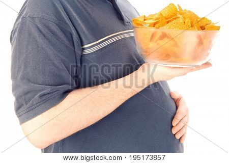Mid-adult man holding glass bowl of potato chips, mid section