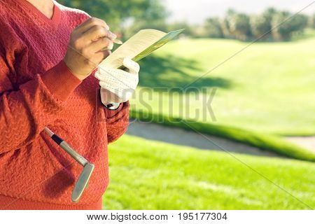 Golfer Writing in Scorecard