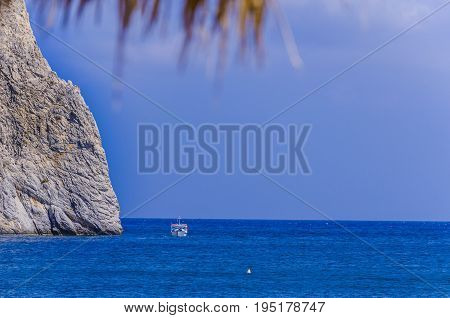 View of the blue color of the Mediterranean sea on the beach of Perissa Santorini Greece