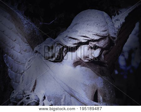 angel of death as a symbol of the end of life (ancient statue)