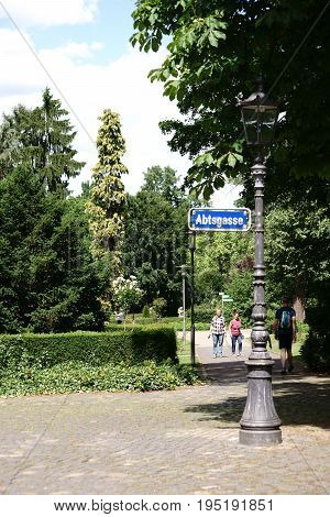 MAINZ, GERMANY - JUNE 10: The entrance of the City Park Mainz with visitors behind a nostalgic lantern on June 10 2017 in Mainz.