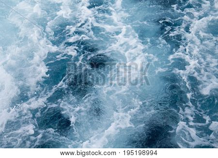 Sea water ship trail with foamy wave. Tropical islands ferry travel. Cruiseliner seawater trail. Deep ocean top view. Big ship pitching image. White swirl wave in sea. Marine cruise travel background