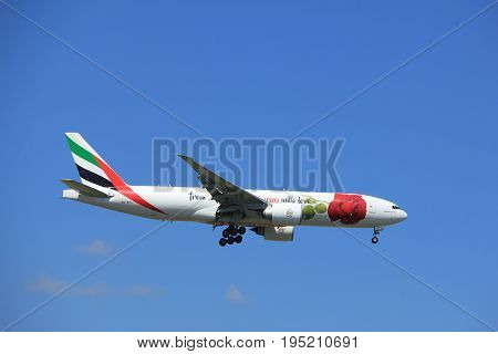 Amsterdam the Netherlands - July 9th 2017: A6-EFL Emirates Boeing 777 approaching Schiphol Amsterdam Airport Kaagbaan runway Red Rose livery