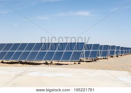 solar panels on the gobi desert clean energy against a blue sky