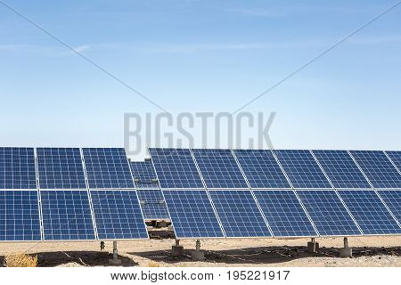 solar panels on the gobi desert clean energy against a blue sky