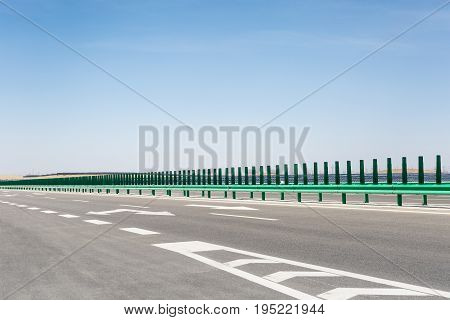 highway on gobi desert with solar power station background