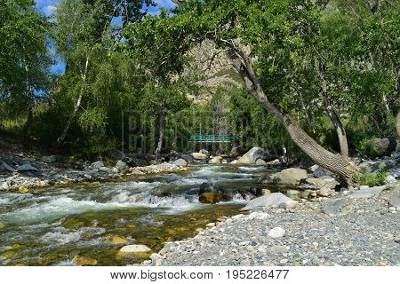 Blue bridge on Big Ilgumen river in Altai mountains. Altay Republic Siberia Russia