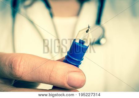 Female Doctor Is Holding Tweezers With A Tick