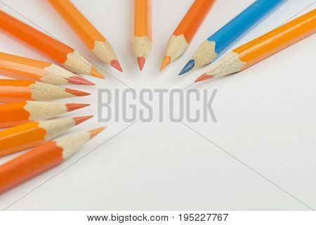 Collection of colored pencils in a half circle shape as background picture